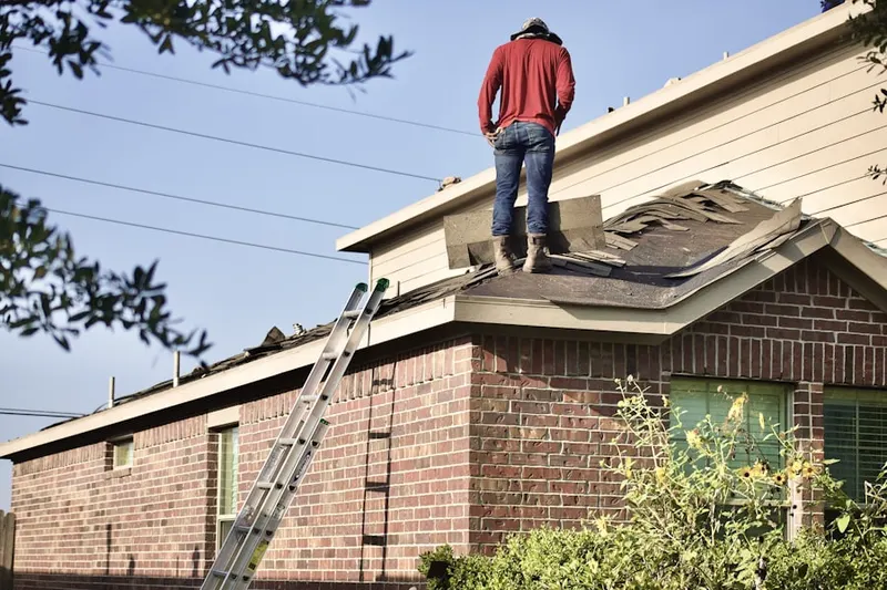 Professional roofer working on a residential roof in Rainbow Springs
